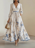 Paz | Vestido largo plisado floral atemporal